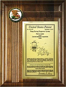 Medallion patent plaque with solid walnut base and corner medallion.